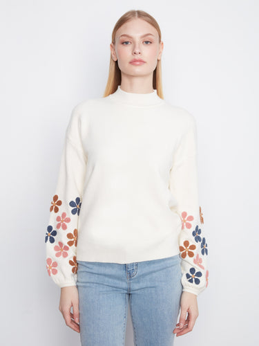 Sweater features a mock neckline, adding a touch of elegance to its casual style. Embroidered floral sleeves enhance its charm by Charlie B.
