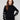 Elegant black sweater with a chic mock neck design, featuring white heart details on sleeves by Charlie B.