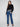 Chic black mock neck sweater with exquisite white floral lace detailing at the hem for a feminine touch by Charlie B.