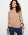 Sweater featuring a cozy mock neck and elegant design, enhanced by Charlie B.