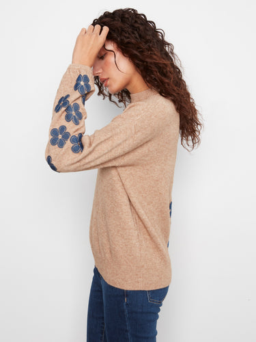 Elegant drop shoulder sweater with unique style elements, made by Charlie B.
