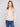 Heather oat sweater with a chic mock neck, showcasing elegant floral embroidery and knit cuffs by Charlie B.