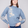 Denim sweater featuring elegant drop shoulders and intricate floral embroidery with sequins, perfect for a chic look by Charlie B.