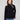 Black sweater featuring a mock neck with unique design by Charlie B.
