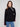 Black sweater featuring a mock neck with unique design by Charlie B.