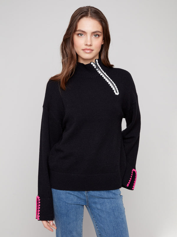 Black sweater featuring a mock neck with unique design by Charlie B.