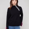 Black sweater featuring a mock neck with unique design by Charlie B.