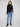 Elegant black sweater with open sleeve cuffs for added flair by Charlie B.