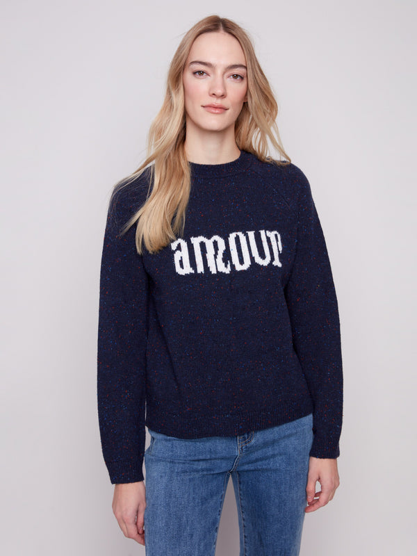 Navy sweater with 'amour' graphic and mock neck, showcasing flecked yarn texture by Charlie B.