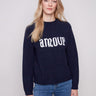 Navy sweater with 'amour' graphic and mock neck, showcasing flecked yarn texture by Charlie B.