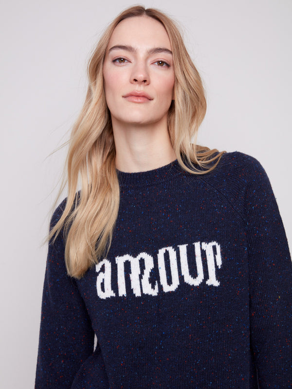 Heather navy sweater featuring raglan sleeves and 'amour' graphic, crafted from flecked yarn by Charlie B.
