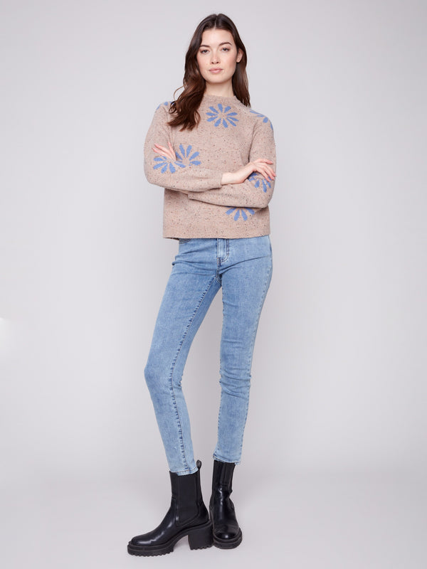 Stylish heather nutmeg knit with bold blue flowers and long sleeves by Charlie B.