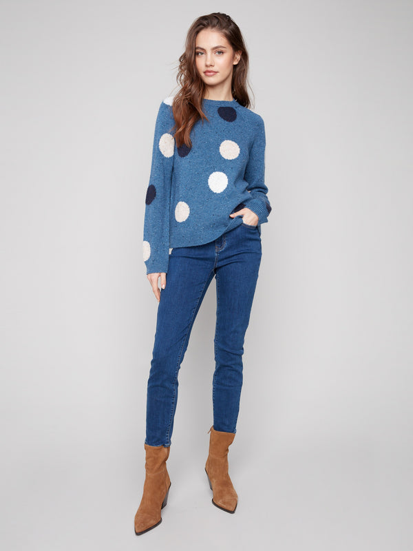 Charming long sleeves and polka dot design make this heather Oxford sweater a must-have by Charlie B.