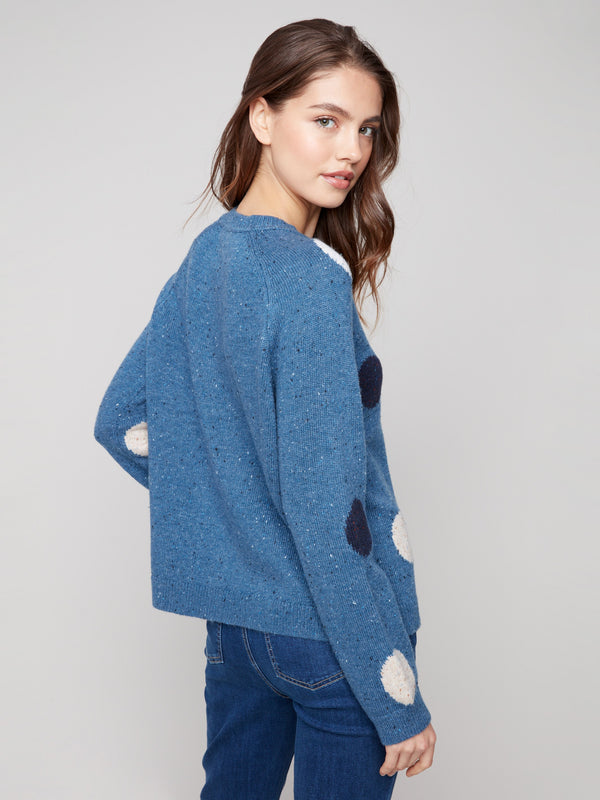 This heather Oxford sweater boasts a classic mock neck and playful polka dot pattern by Charlie B.