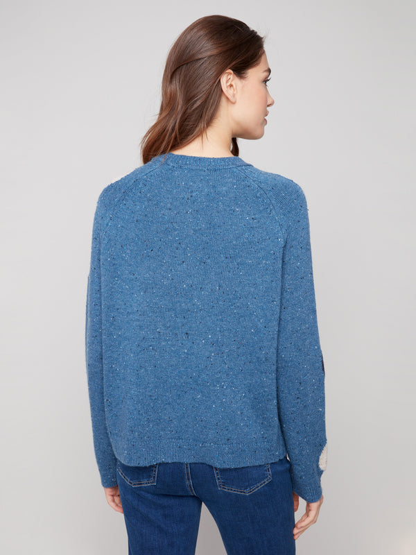 Long-sleeved comfort meets chic style in this heather Oxford sweater with polka dots by Charlie B.