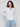 Denim-colored sweater featuring a cozy eyelash yarn material, perfect for chilly days with its soft texture by Charlie B.