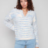 Denim-colored sweater featuring a cozy eyelash yarn material, perfect for chilly days with its soft texture by Charlie B.