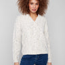 Ecru cable knit sweater crafted with eyelash yarn for a soft touch by Charlie B.