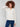 Ecru sweater featuring drop shoulder design and striped pattern by Charlie B.