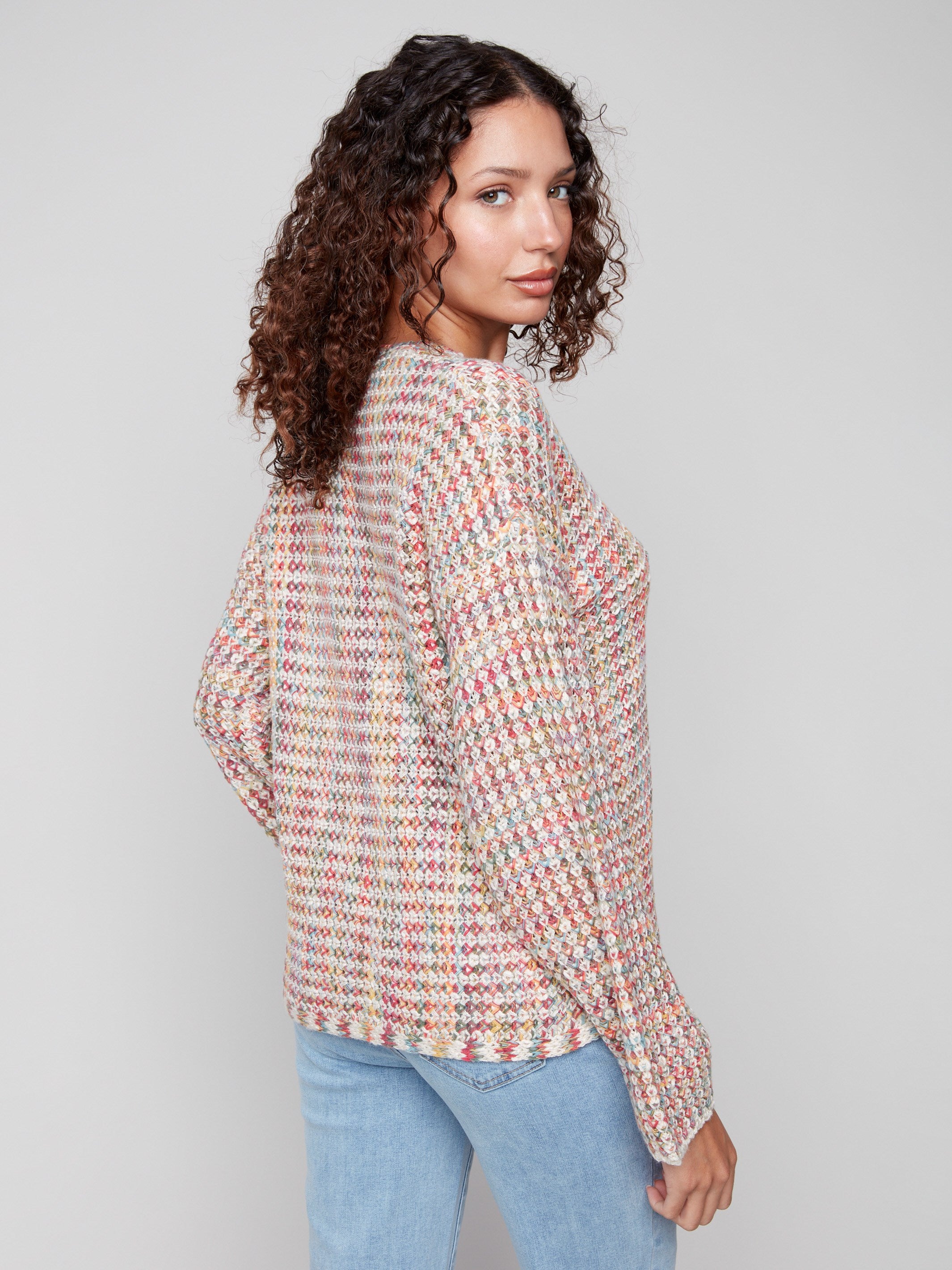 Charming multicolor crochet sweater showcasing a unique drop shoulder design, made from novelty yarn by Charlie B.