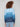 Blue ombre sweater highlighted with knit cuffs, showcasing a seamless blend of colors in an artistic gradient by Charlie B.