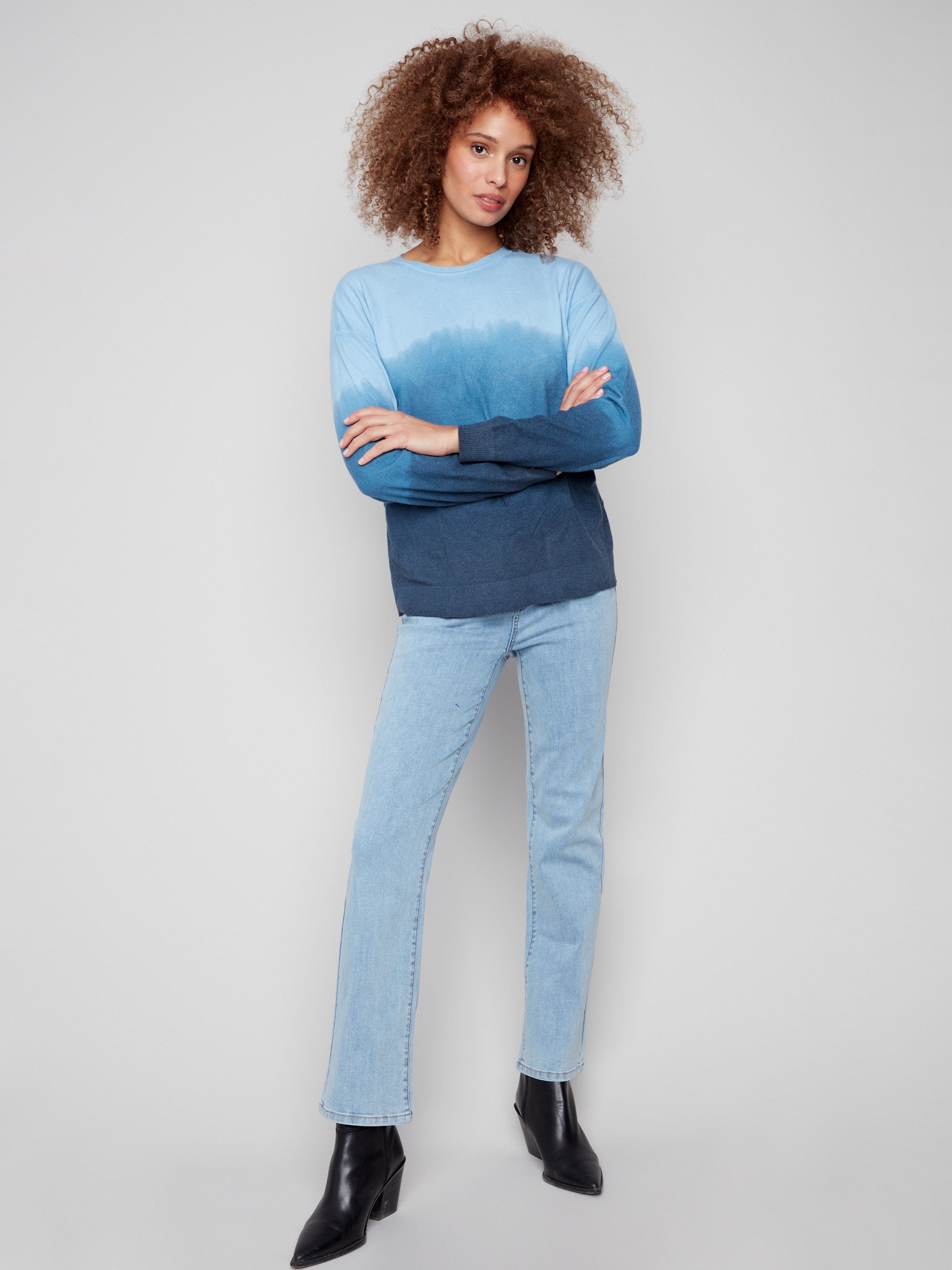 Ombre sweater in blue with a refined crew neck and knit cuffs, presenting an elegant gradient design by Charlie B.