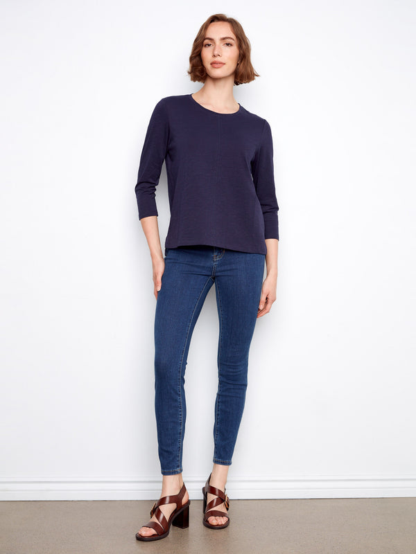 Chic top with a distinctive front seam detail, adding a subtle touch of elegance to your look. Crafted by Charlie B.