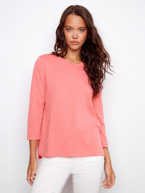 Comfortable 3/4 sleeves on this pink top provide ease and elegance for everyday wear. By Charlie B.