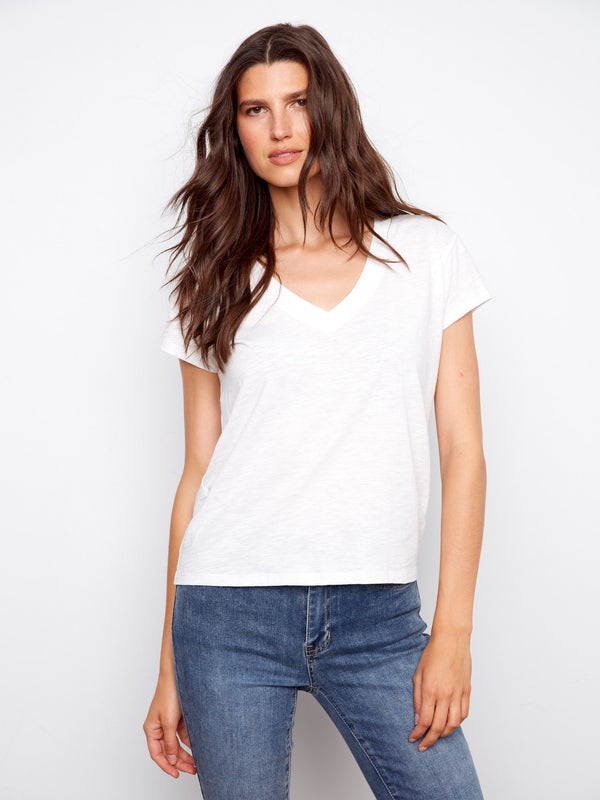 White short-sleeve T-shirt with a lightweight cotton fabric, featuring a stylish V-neck by Charlie B.