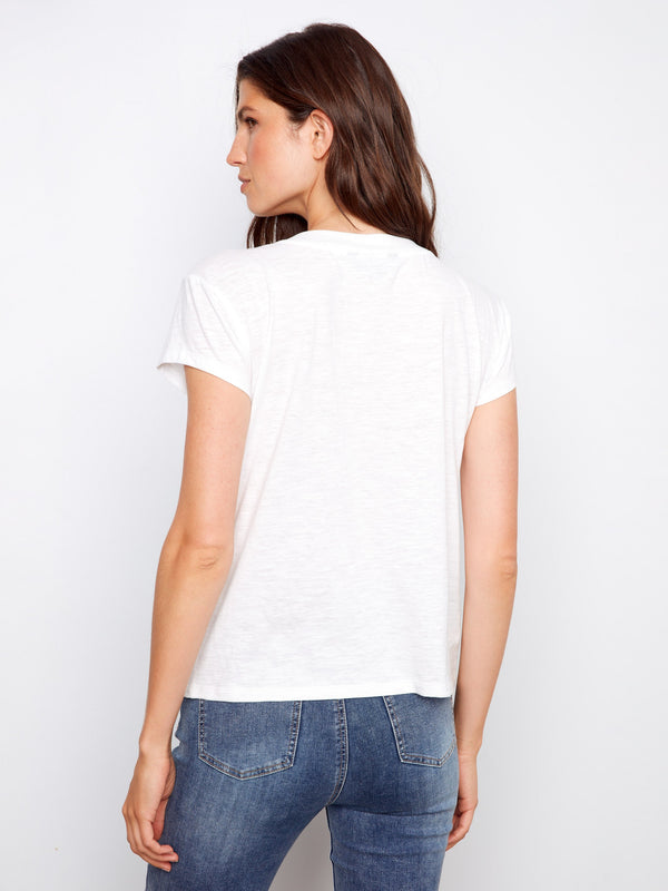 White tee with soft fabric and classic V-neckline, ideal for layering by Charlie B.