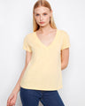 This yellow t-shirt features a flattering V-neck, perfect for casual outings. Made with lightweight cotton for comfort. By Charlie B.