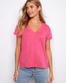 Pink V-neck top featuring a stylish drop shoulder design, ideal for casual outings. Made from lightweight cotton by Charlie B.