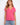 Pink V-neck top featuring a stylish drop shoulder design, ideal for casual outings. Made from lightweight cotton by Charlie B.