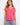 Pink V-neck top featuring a stylish drop shoulder design, ideal for casual outings. Made from lightweight cotton by Charlie B.