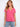 Pink V-neck top featuring a stylish drop shoulder design, ideal for casual outings. Made from lightweight cotton by Charlie B.
