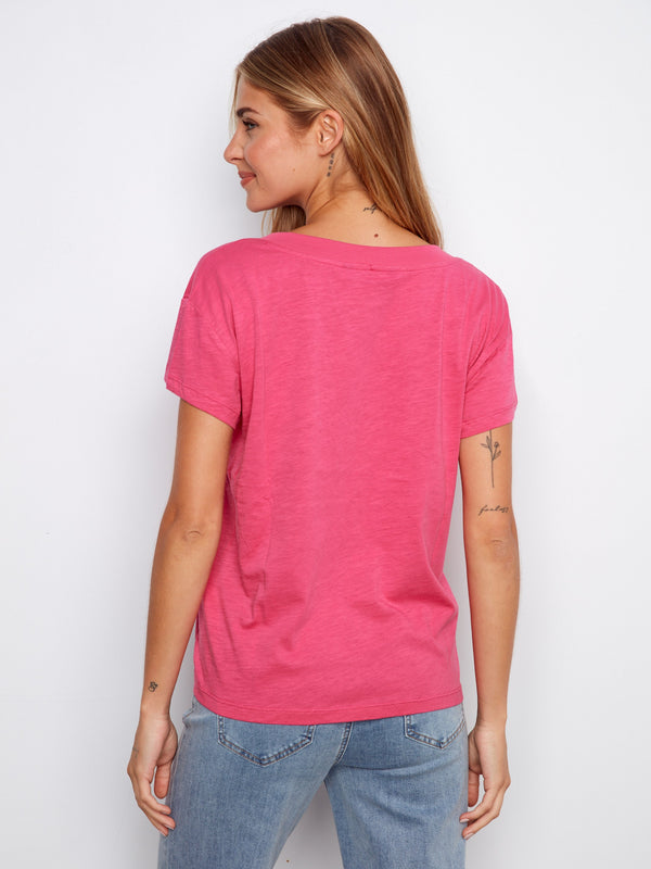 Lightweight cotton tee in vibrant pink with a classic V-neck style. Ideal for layering or solo wear by Charlie B.