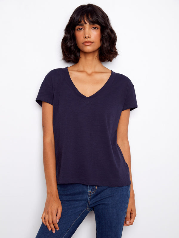 Elegant V-neck top in soft cotton, perfect for casual outings. The drop shoulder design adds a relaxed vibe. By Charlie B.