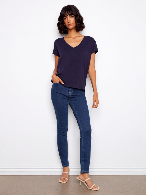 Chic and versatile, this drop shoulder top is crafted from breathable cotton, offering all-day comfort and style. By Charlie B.