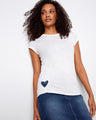This white top features a charming heart-shaped cutout detail, adding a playful touch to any outfit. Made by Charlie B.