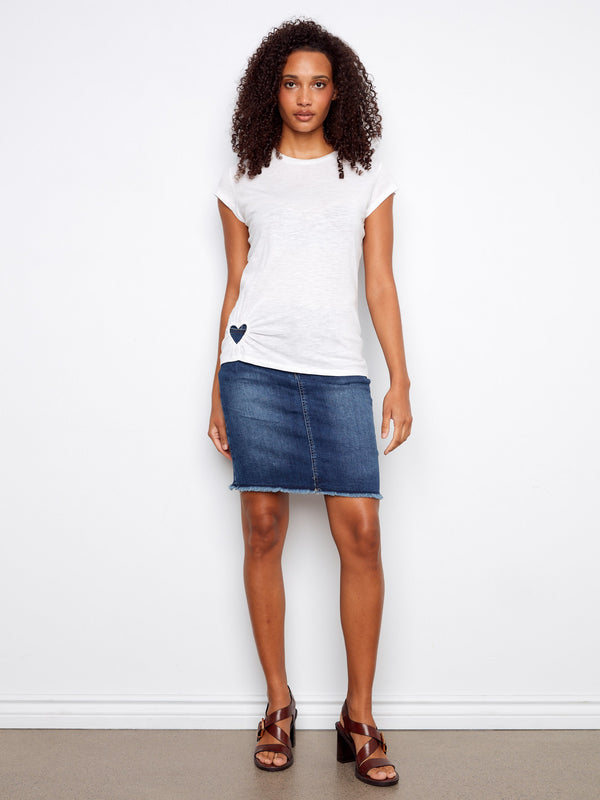 The short sleeves on this white top provide a casual yet stylish look perfect for warm days. Fashioned by Charlie B.