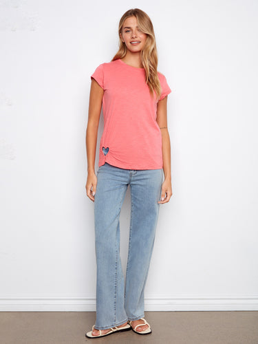 The heart-shaped cutout detail adds a playful touch to this versatile top. Crafted with care from pure cotton by Charlie B.