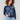 Heather denim sweater featuring paisley embroidery and a comfortable crew neck, perfect for any occasion by Charlie B.