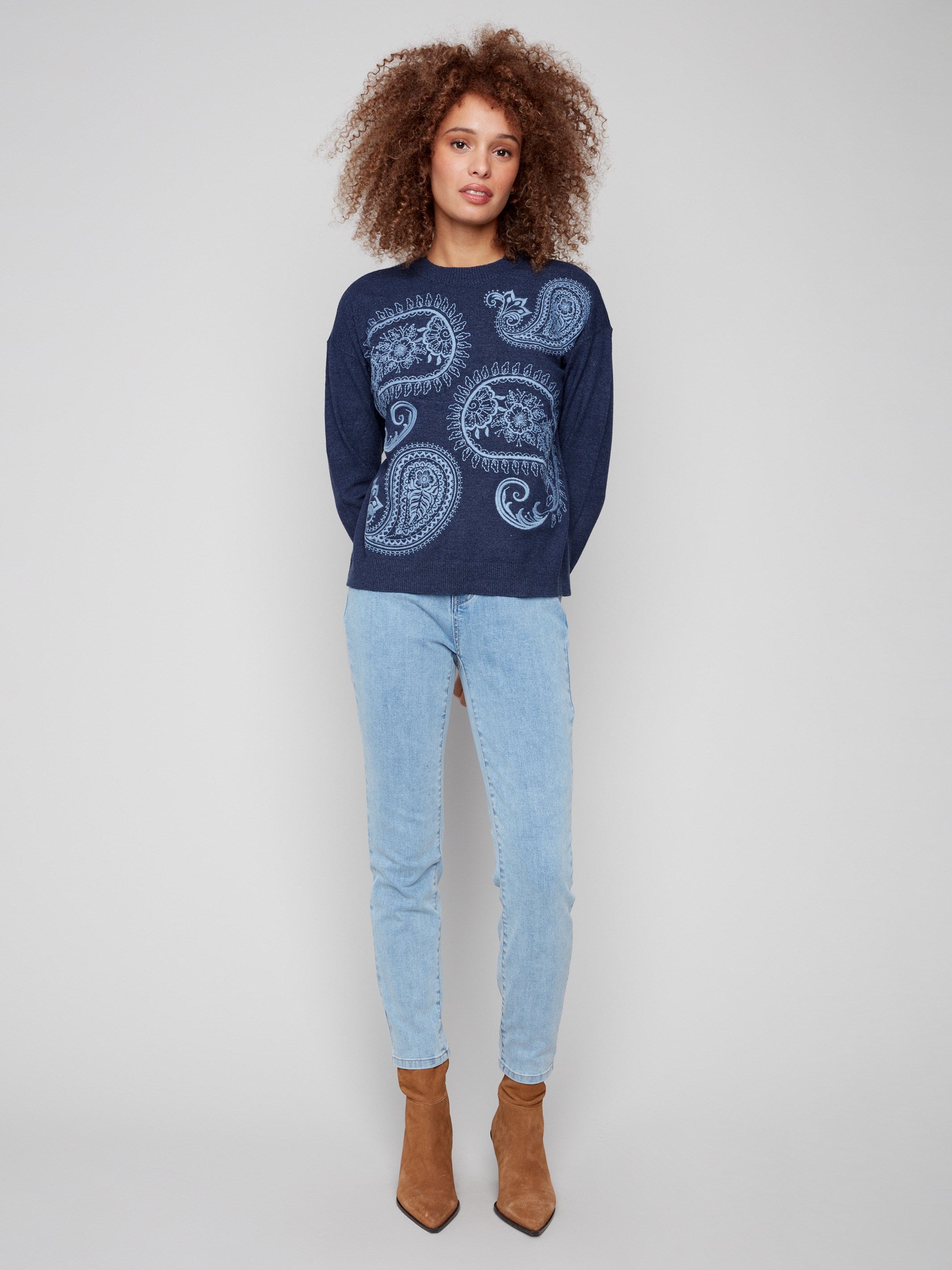 Enjoy the ribbed cuffs on this heather denim sweater with detailed paisley patterns by Charlie B.