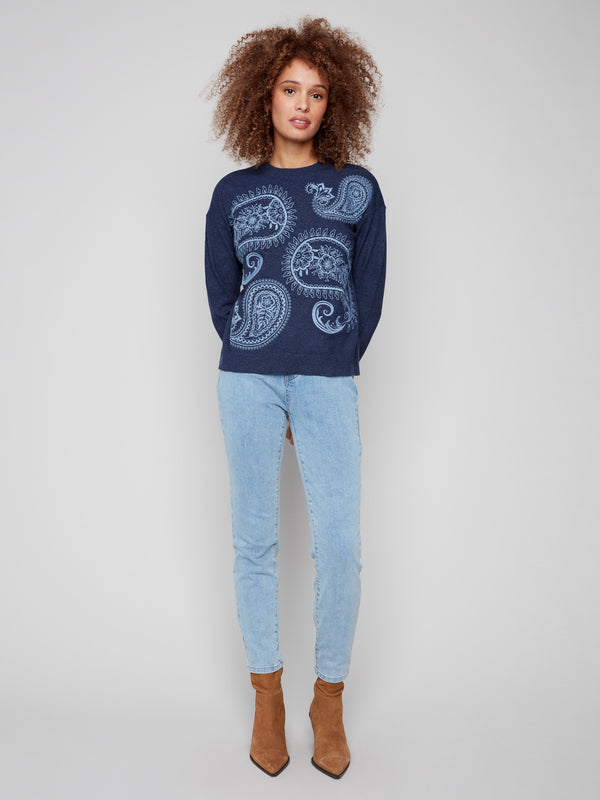 Enjoy the ribbed cuffs on this heather denim sweater with detailed paisley patterns by Charlie B.