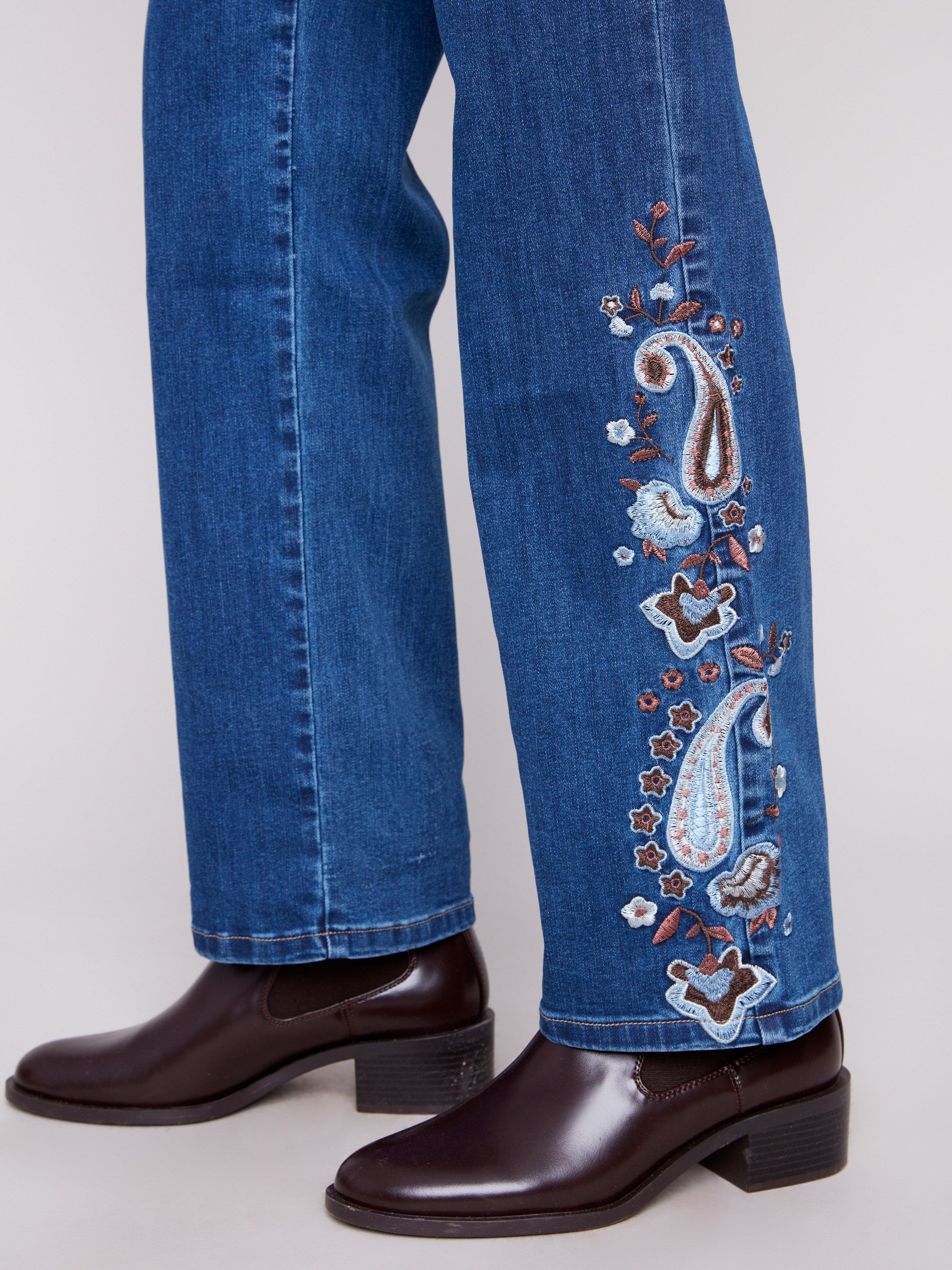 Regular rise indigo jeans adorned with beautiful paisley embroidery for added style by Charlie B.