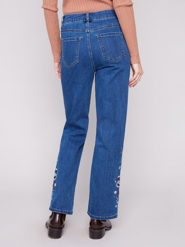 Indigo jeans in a straight fit, highlighted by exquisite paisley embroidery along the legs by Charlie B.