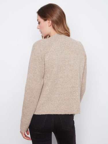 Chic open-front cardigan showcasing a classic design with raglan sleeves for added elegance. Fashioned by Charlie B.
