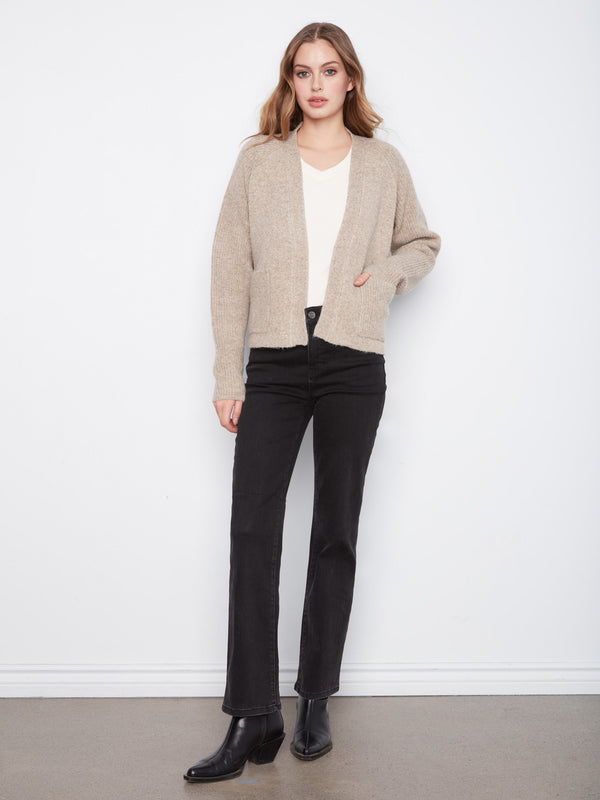 Cozy cardigan with an open-front design, perfect for layering over any outfit. Crafted for comfort and style by Charlie B.