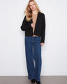 Black cardigan with open-front design, featuring patch pockets and a cozy feel by Charlie B.