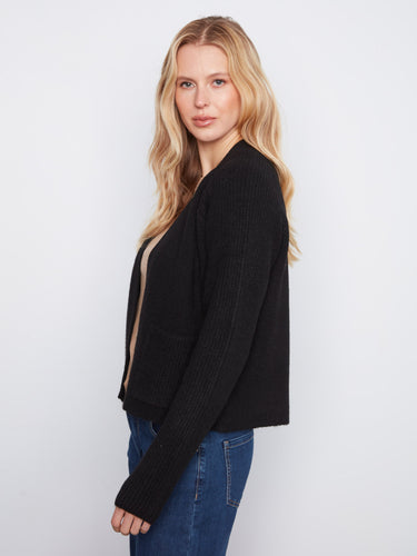 Elegant black cardigan highlighting the open-front style and functional patch pockets by Charlie B.